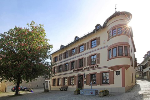 Historic Mohren Pharmacy built 17th century in backlight, building with corner turrets, turrets,