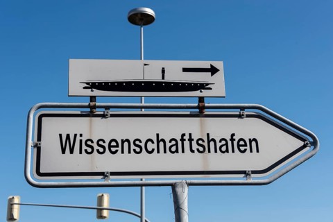 Sign pointing the way to Magdeburg Science Harbour, Saxony-Anhalt, Germany, Europe