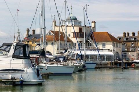 Yachts at moorings in harbour of Royal Norfolk and Suffolk yacht Club, Lowestoft, Suffolk, England,