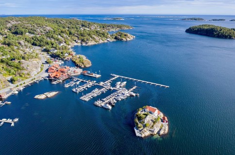 Aerial view of marina and single house on an island, southern norwegian coast, east of Kragerø, oil