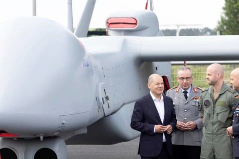 Olaf Scholz (Chancellor of the Federal Republic of Germany, SPD) in front of an IAI Heron TP drone