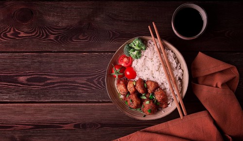 Asian traditional cuisine, fried chicken Teriyaki, with side dish, rice and vegetables, top view,