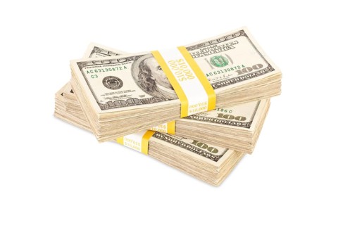 Ten thousand dollar stacks of one hundred dollar bills isolated on white