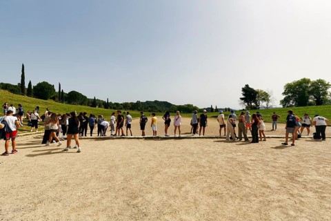 Tourist group in the stadium, birthplace of the Olympic Games, Olympic Stadium, ancient Olympia,