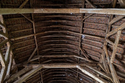 Interior showing wooden truss of 13th century Gothic monastic tithe barn of the Ter Doest Abbey at