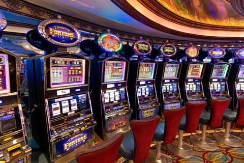 Seattle, USA, 18 September 2022: Casino gambling blackjack and slot machines waiting for gamblers
