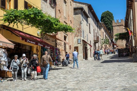 People on the central street in the medieval Gradara Castle, Marche, Italy, Europe