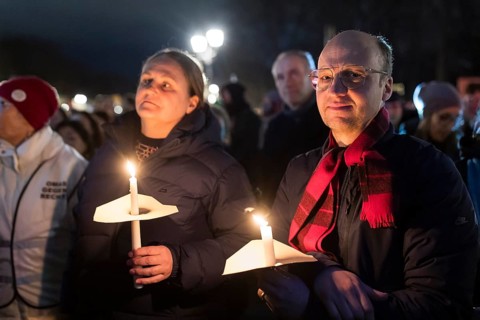 Participants with candles at the demonstration under the motto Sea of Lights against the shift to