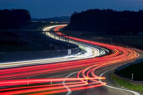 Tracers on the A8 motorway, winding road, evening, long exposure, Swabian Alb, Baden-Württemberg,
