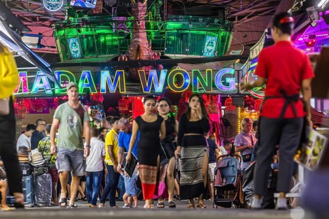 Crowds of people on Bangla Street in the evening. Nightlife on Bangla Walking Street with go-go