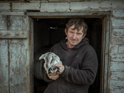 Vova, 46 years old, farmer from Borshchivka with a goatling. The village was under Russian
