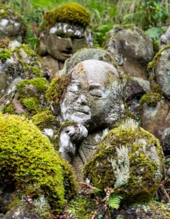 Close-up of moss-covered stone statue of rakan, the disciple of Buddha, Otagi Nenbutsu-ji temple,