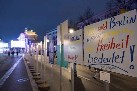 Signs painted by children with the inscription Without freedom everything is nothing and Kyiv and