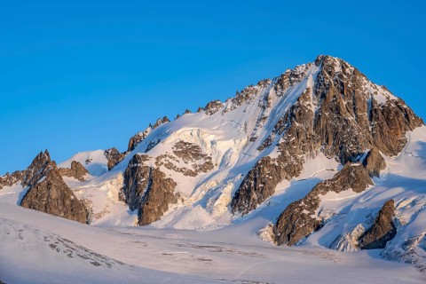 High alpine mountain landscape at sunset, summit of the Aiguille de Chardonnet and Glacier du Tour