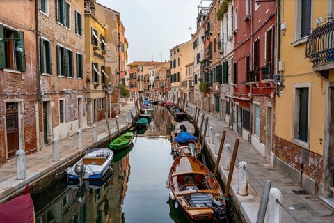 Motorboats and colourful house facades on a small canal, Venice, Veneto, Italy, Europe