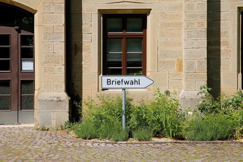 Postal voting sign, signpost for postal voting, writing, letters, information board, behind