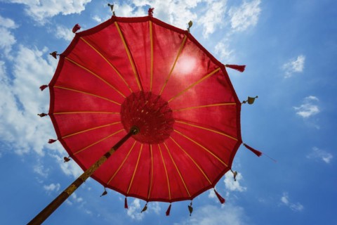 Traditional Balinese temple sunshade as parasol, Hinduism, symbol, beach holiday, protection, sun