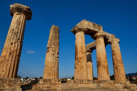 Archaic Temple of Apollo, Doric columns, Ancient ruins with rows of columns under a clear blue sky,