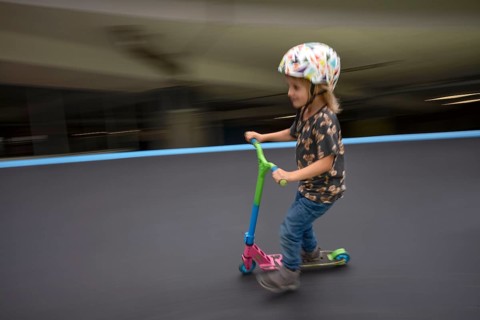 Little boy, 5 years, blond, helmet, helmet, riding on scooter, scooter, skater track, playground,
