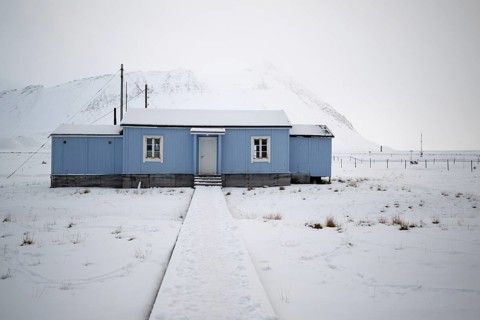 Blue house, winter landscape, research settlement, Ny-Ålesund, Spitsbergen Island, Svalbard and Jan