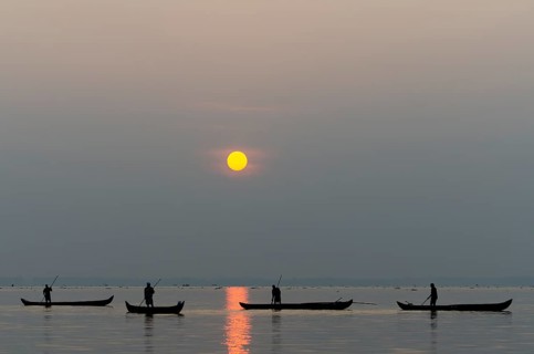 Fishermen on the Vembanad Lake at sunrise, Kerala, South India, India, Asia