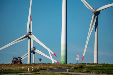 Wind farm near Lichtenau, wind turbines, country road, Driburger Straße, tractor at work in the