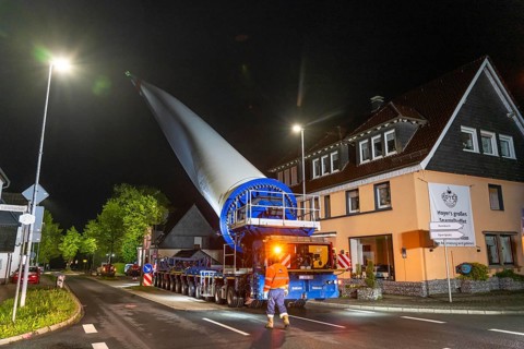 Transport of a 68 metre long, 22 tonne blade of a wind turbine, here in Breckerfeld-Waldbauer, with