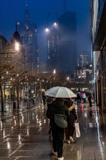 Rainy weather, freezing rain, pedestrian zone Zeil, shopping street, high-rise skyline in clouds,