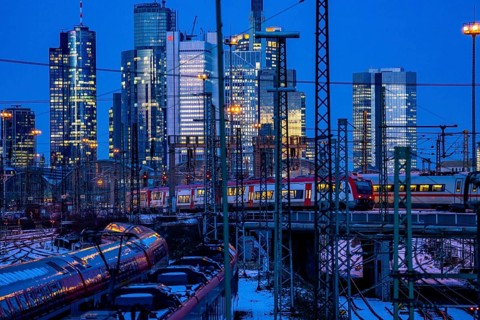 Railway tracks in front of the main railway station in Frankfurt am Main, skyline of skyscrapers in