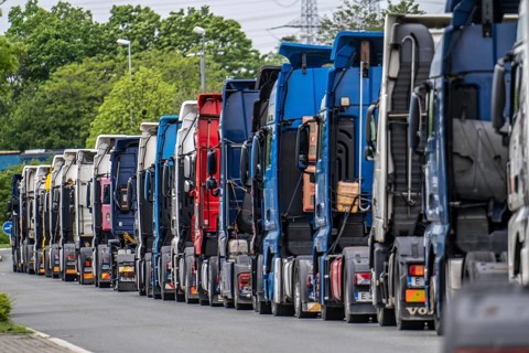 Truck tractors, exclusively from Eastern European countries, park in the harbour area, the canal