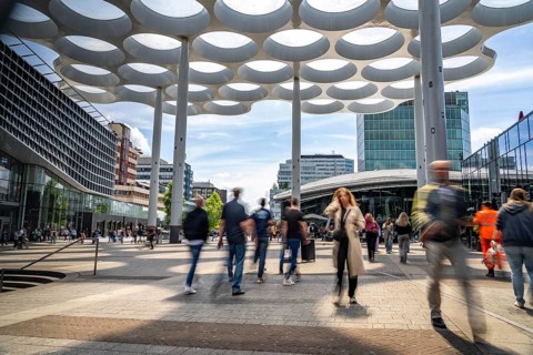 Station forecourt of Utrecht Centraal station, people on their way to and from the station, Hoog