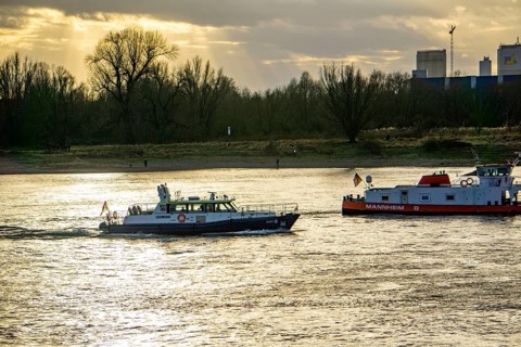 The Rhine near Düsseldorf, cargo ships, patrol boat of the water police, North Rhine-Westphalia,