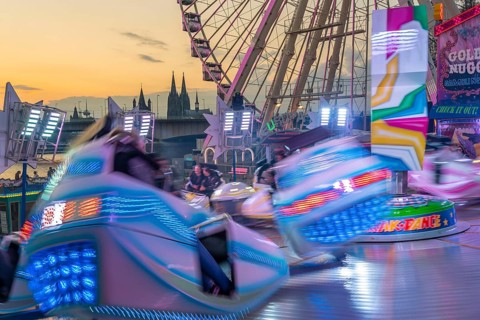 Deutz funfair on the Rhine, at Easter, funfair, break-dancer ride, Ferris wheel, Cologne Cathedral,