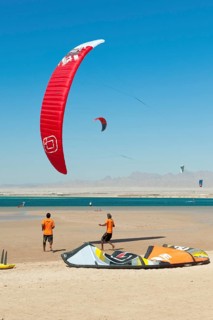 Kitesurfer kite surfer kite surfers training making course course on beach in front of Red Sea bay,