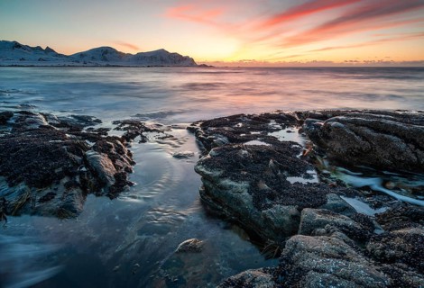 Sunset in winter at Skagsanden, rock formations on the beach at Flakstad, Flakstadøy, Lofoten,