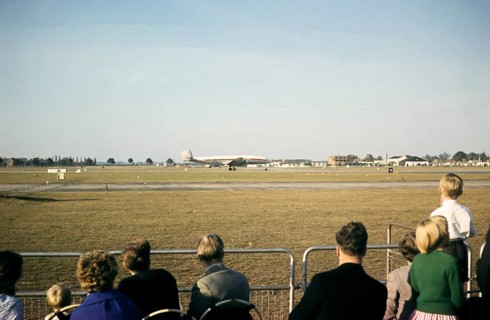 Aircraft spotters watching Lockheed Super Constellation aircraft on the runway, Heathrow Airport,
