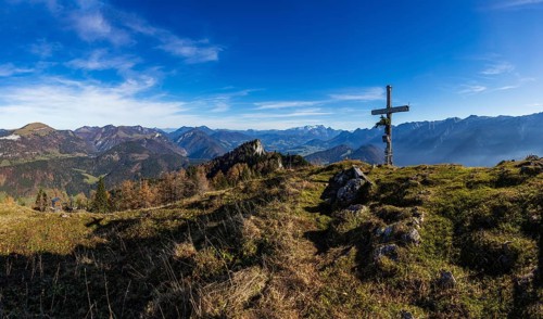 Drone shot, summit cross on the Schwarzer Berg with a view of the Lammertal with Dachstein massif