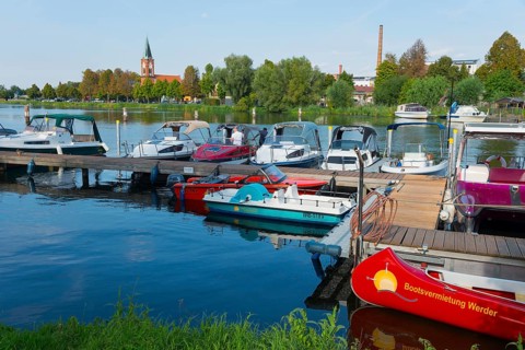 A harbour with several boats and a church in the background, Maria Meeresstern church, old town