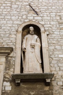 Religious statue in recess on outside wall of City Museum, Sibenik, Croatia, Europe