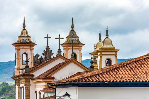 Towers and crucifixes of a baroque church in the historic city of Mariana in Minas Gerais Mariana,