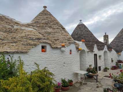 Trulli house decorated with pumpkins, Alberobello, UNESCO World Heritage Site, Apulia, Italy,