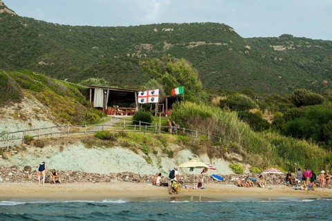 Beach and beach bar, near Alghero, Sardinia, Italy, Europe