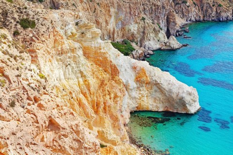 Multicoloured rock formations plunging into the sea, Firopotamos, Milos Island, Cyclades Islands,