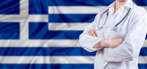 Doctor with crossed arms on Greek flag. Greece Health and Care concept. Female doctor on Greek flag
