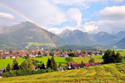 View over Oberstdorf with rainbow and Allgäu Alps, Oberallgäu, Bavaria, Germany, Europe