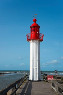 Close-up of a red lighthouse with blue sky and sea, Trouville-sur-Mer, Trouville, river Touques,