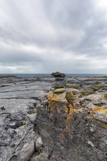 Bizarrely shaped limestone slabs, stacks of stones on the coastline, limestone coast of the Burren,