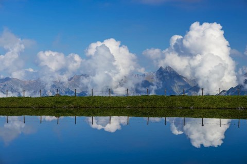 Artificial lake, snow pond, at the mountain station of the Kanzelwand cable car, panoramic view of