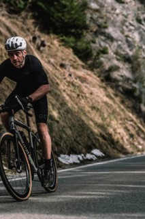 Road bike rider in spring between Lechtal and Tannheimer Tal in front of picturesque scenery of the