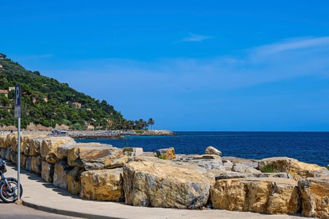 Long pier and coastline of the Riviera di Ponente with a view of the Ligurian Sea in the Oneglia